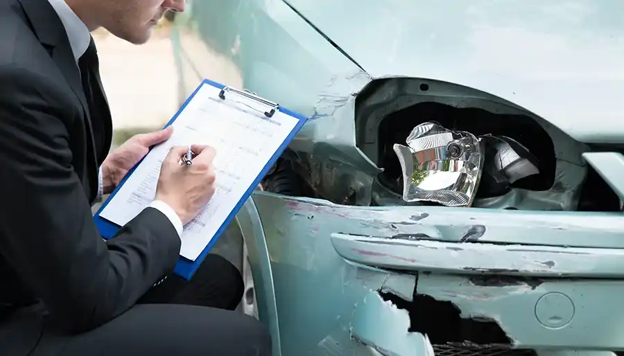 Car driving on road representing vehicle insurance
